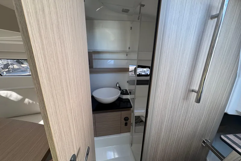 Slide: The Image of 2026 Jeanneau Leader 9.0 WA Series 2 bathroom with modern sink and wooden cabinetry. - 10