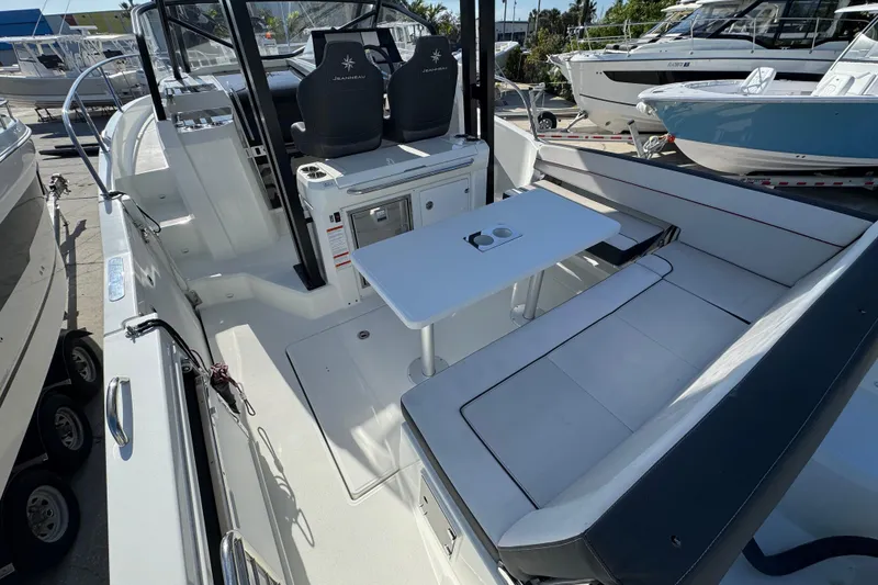 Slide: The Image of 2026 Jeanneau Leader 9.0 WA Series 2 boat interior with seating and table. - 3
