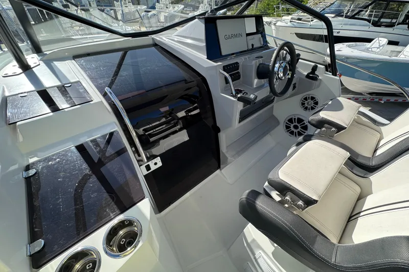 Slide: The Image of 2026 Jeanneau Leader 9.0 WA Series 2 cockpit with Garmin navigation system and dual seating. - 6