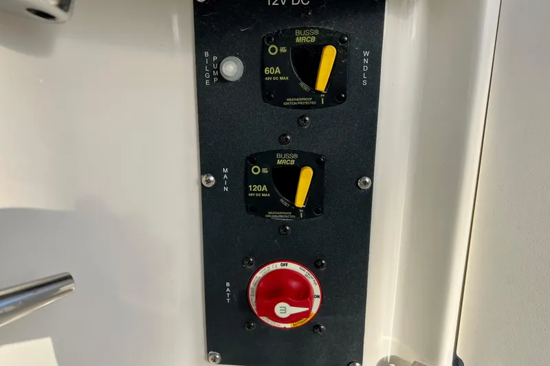 Slide: The Image of Control panel of 2025 Boston Whaler 240 Vantage with circuit breakers. - 10