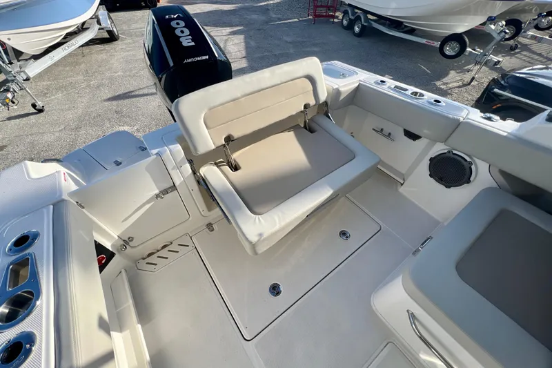 Slide: The Image of Interior of 2025 Boston Whaler 240 Vantage with seating and motor. - 11