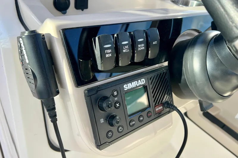 Slide: The Image of Boston Whaler 240 Vantage 2025 control panel with Simrad device. - 16