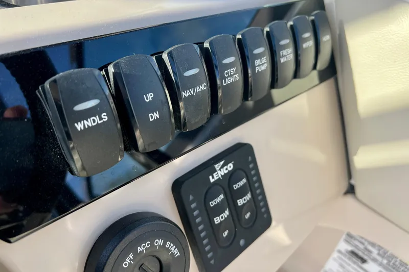Slide: The Image of Control panel of 2025 Boston Whaler 240 Vantage with switches and controls. - 17