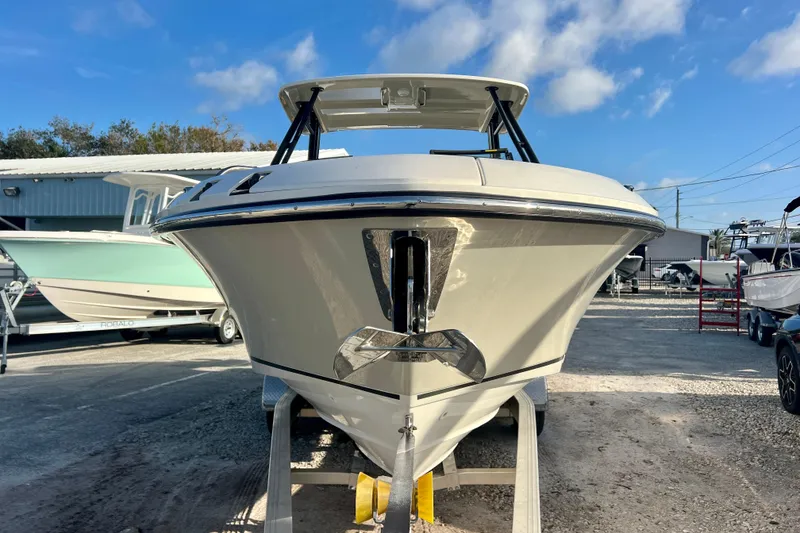 Slide: The Image of 2025 Boston Whaler 240 Vantage boat on a trailer. - 2