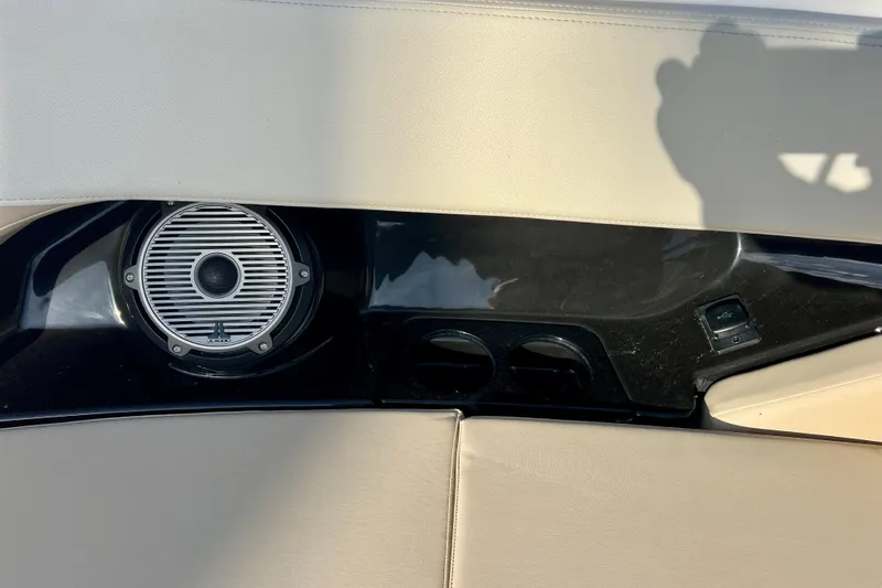 Slide: The Image of 2025 Boston Whaler 240 Vantage interior speaker and cup holders. - 25