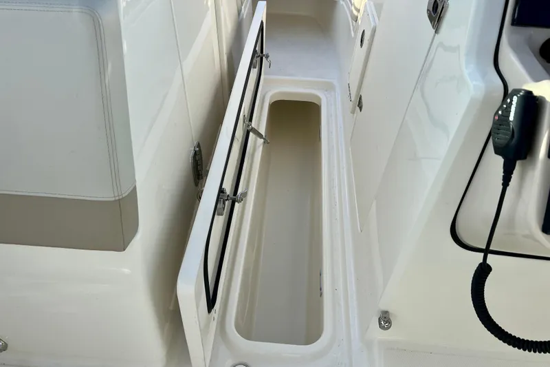 Slide: The Image of Storage compartment in Boston Whaler 240 Vantage 2025 boat. - 27