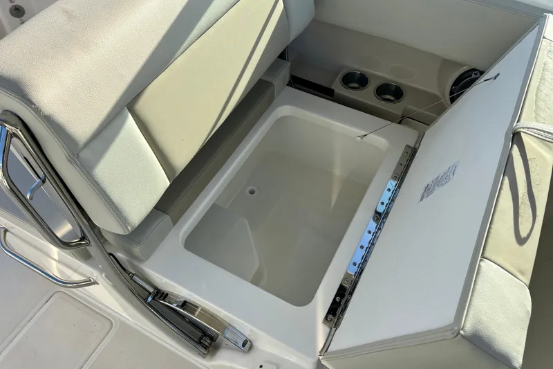 Slide: The Image of Boston Whaler 240 Vantage 2025 seat with storage compartment. - 28