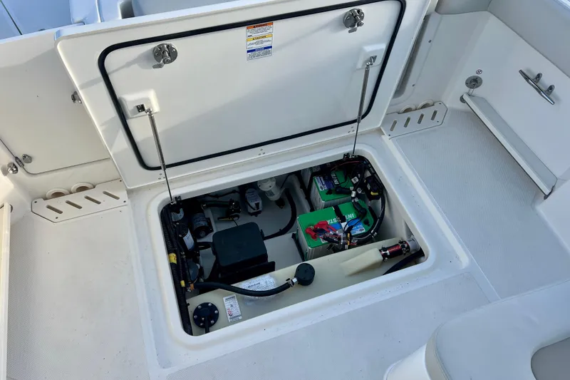 Slide: The Image of View of the engine compartment in the 2025 Boston Whaler 240 Vantage. - 31