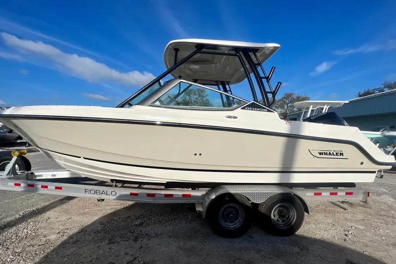 Slide: The Image of 2025 Boston Whaler 240 Vantage boat on trailer, side view. - 4