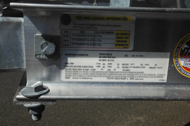 Slide: The Image of Trailer tire and loading information label on a Maritime Skiff 1690, 1999 model. - 12