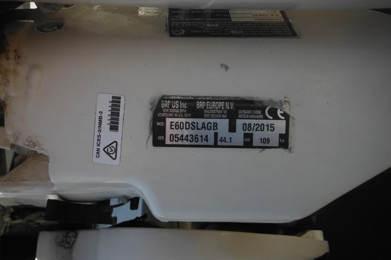 Slide: The Image of Label on Maritime Skiff 1690, 1999 model, showing engine details and specifications. - 15