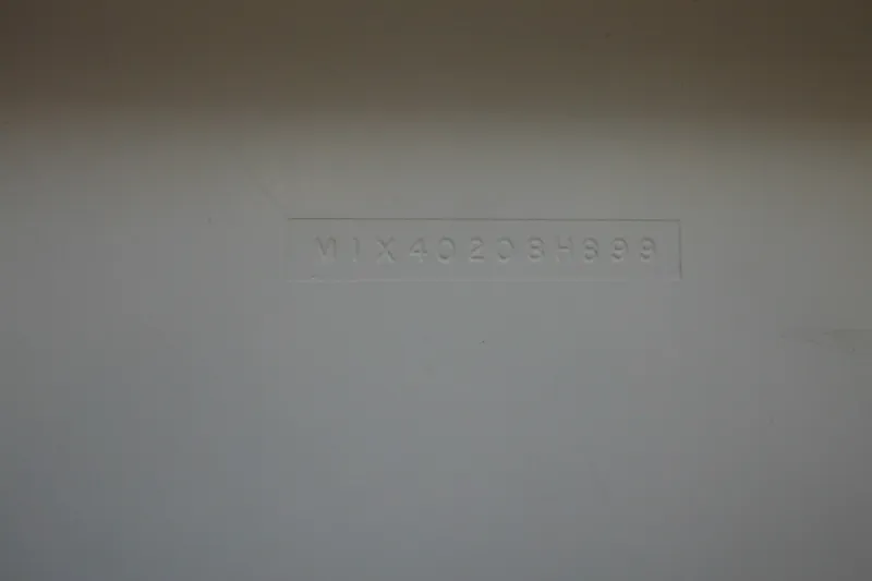 Slide: The Image of Hull identification number on a 1999 Maritime Skiff 1690 boat. - 16