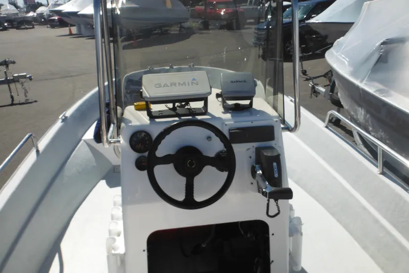Slide: The Image of 1999 Maritime Skiff 1690 boat console with Garmin navigation system. - 19