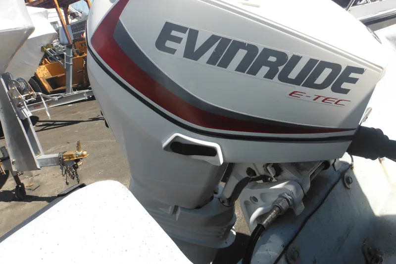 Slide: The Image of 1999 Maritime Skiff 1690 with Evinrude E-TEC outboard motor. - 24