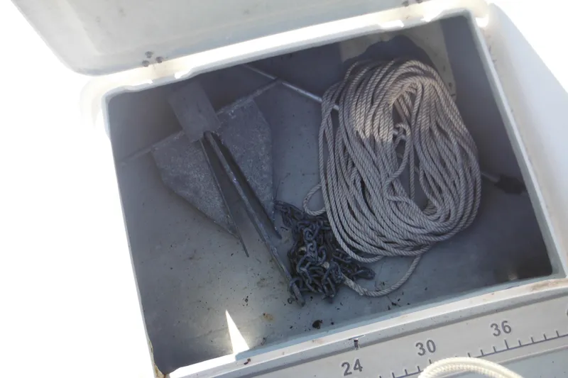 Slide: The Image of Anchor and rope storage in a 1999 Maritime Skiff 1690 boat compartment. - 27