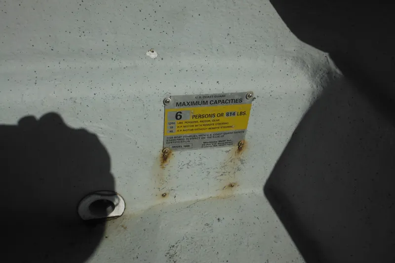 Slide: The Image of 1999 Maritime Skiff 1690 capacity plate, showing maximum load and passenger limits. - 33