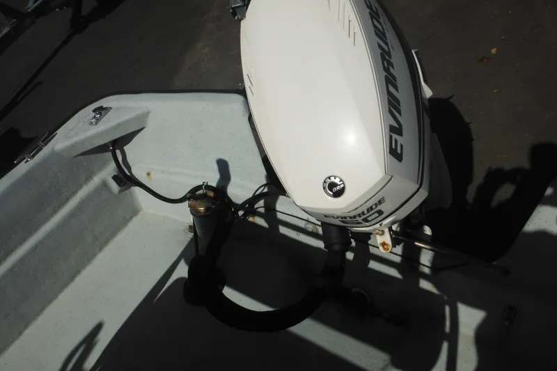 Slide: The Image of 1999 Maritime Skiff 1690 with Evinrude outboard motor, interior view. - 34