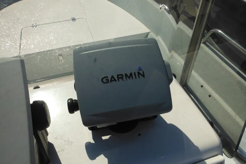 Slide: The Image of Garmin device on 1999 Maritime Skiff 1690 boat dashboard. - 38