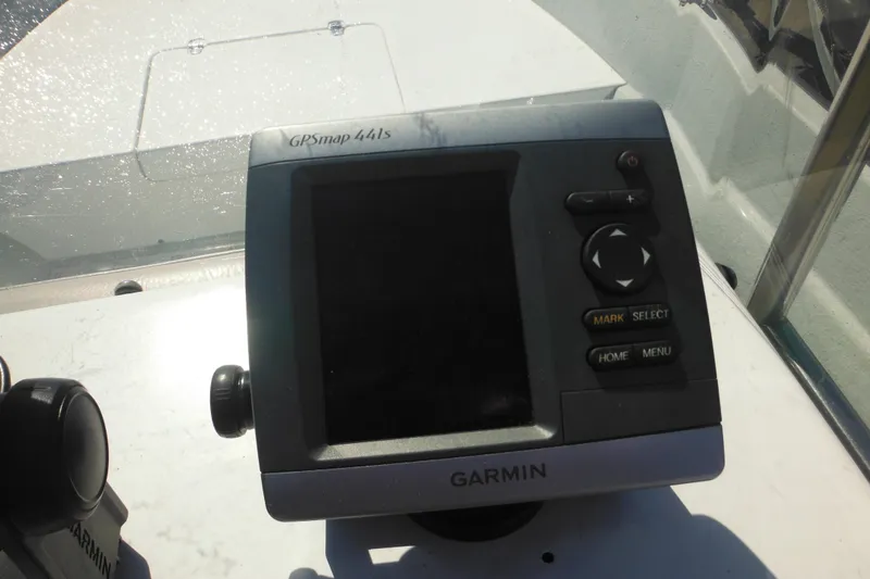 Slide: The Image of Garmin GPSmap 441s on 1999 Maritime Skiff 1690 boat dashboard. - 39