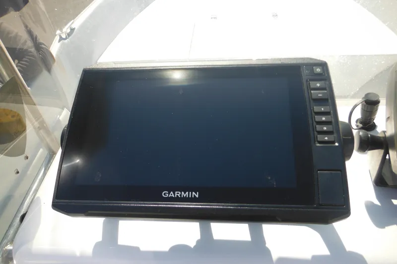 Slide: The Image of Garmin navigation system on a 1999 Maritime Skiff 1690 boat dashboard. - 40