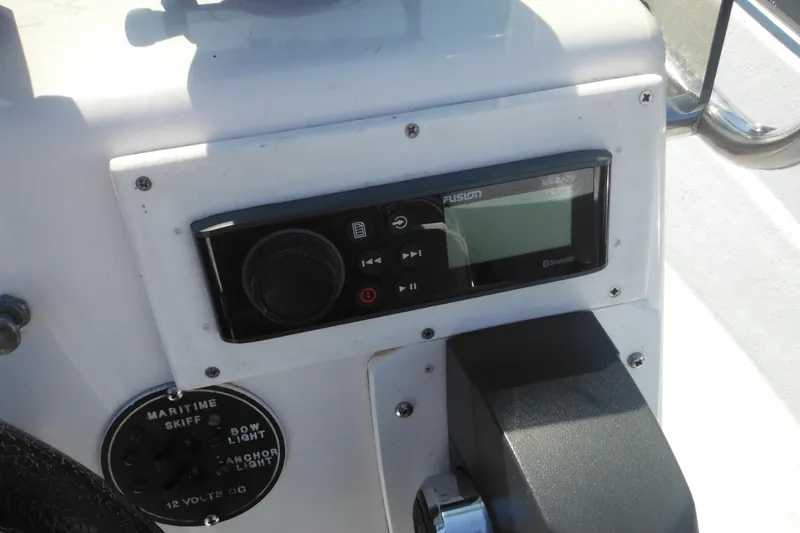 Slide: The Image of Control panel of a 1999 Maritime Skiff 1690 with Fusion MS-RA70 stereo system. - 41