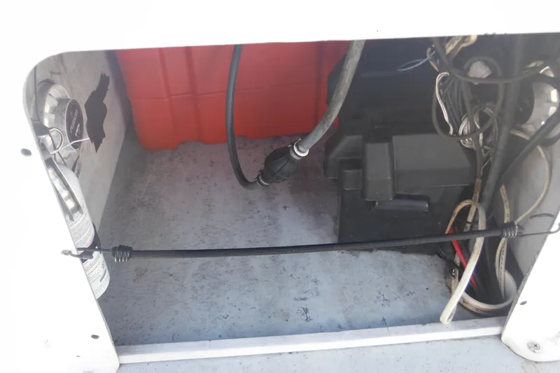 Slide: The Image of Interior view of a 1999 Maritime Skiff 1690 showing wiring and equipment. - 43