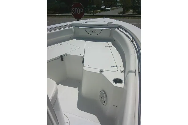 Slide: The Image of 2015 Sea Hunt Ultra 225 boat interior with seating and storage compartments. - 13