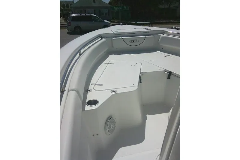 Slide: The Image of 2015 Sea Hunt Ultra 225 boat interior with seating and storage compartments. - 14