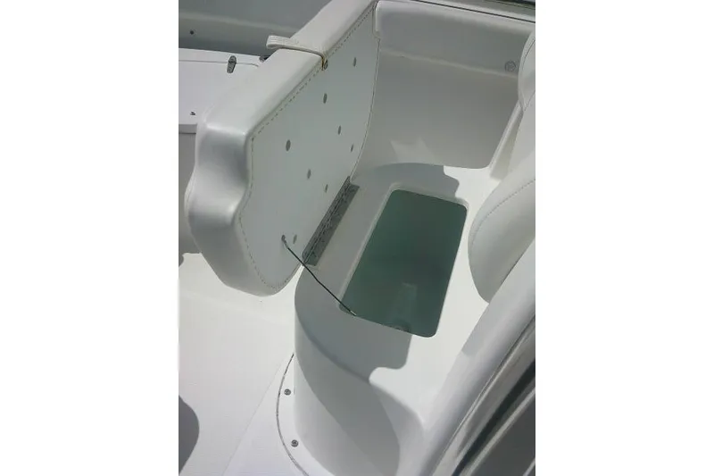 Slide: The Image of 2015 Sea Hunt Ultra 225 boat seat with storage compartment open. - 18