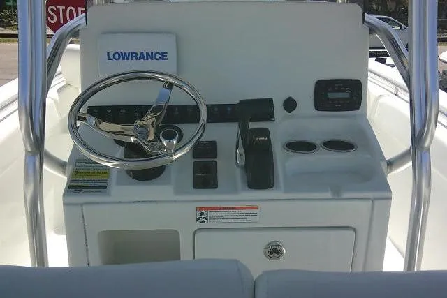 Slide: The Image of 2015 Sea Hunt Ultra 225 boat console with Lowrance system and steering wheel. - 32