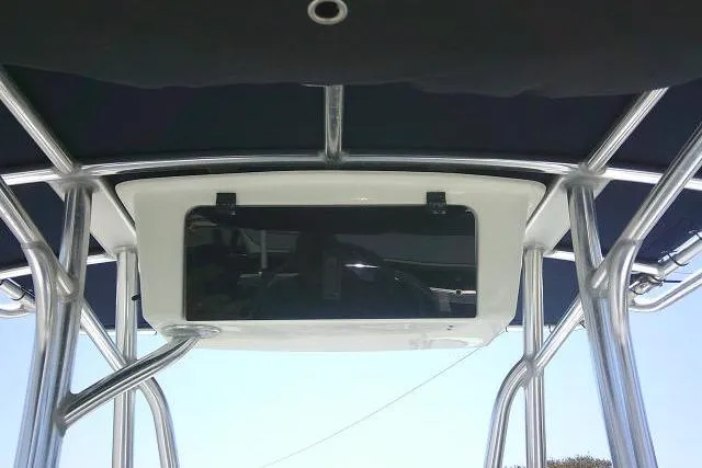 Slide: The Image of 2015 Sea Hunt Ultra 225 boat T-top with storage compartment and sturdy metal frame. - 33