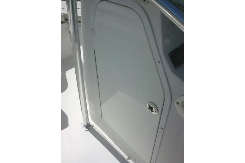 Slide: The Image of 2015 Sea Hunt Ultra 225 boat door with sleek design and secure latch. - 34