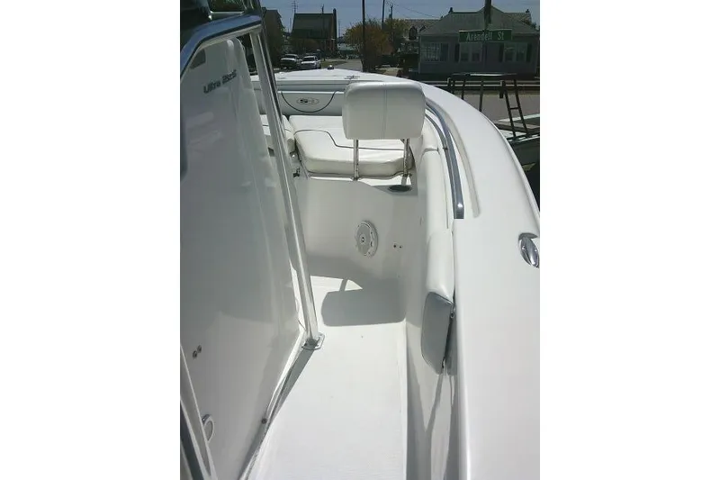 Slide: The Image of 2015 Sea Hunt Ultra 225 boat interior with white seating and sleek design. - 38