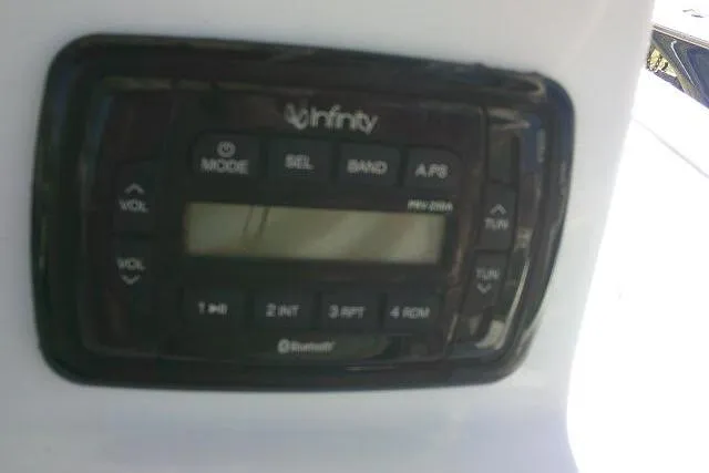 Slide: The Image of Infinity marine stereo system on a 2015 Sea Hunt Ultra 225 boat dashboard. - 40