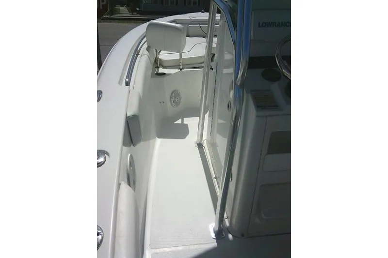 Slide: The Image of 2015 Sea Hunt Ultra 225 boat interior with seating and steering console. - 44
