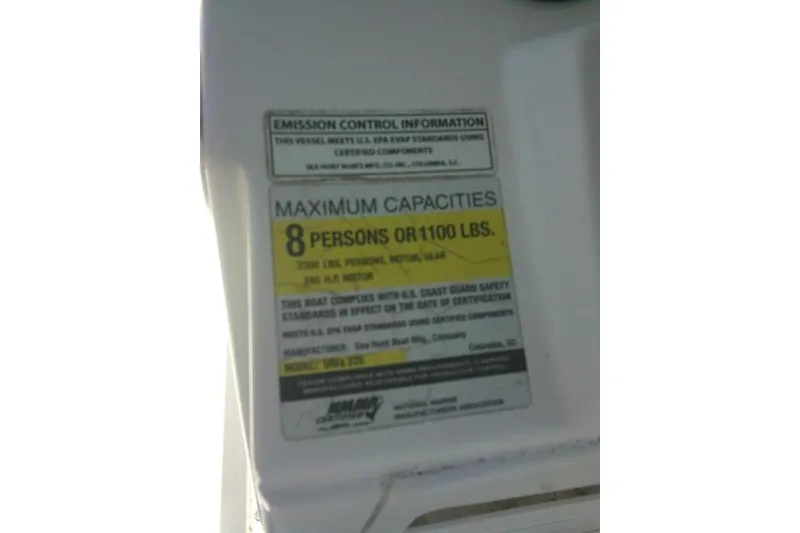 Slide: The Image of 2015 Sea Hunt Ultra 225 capacity label, maximum 8 persons or 1100 lbs. - 47