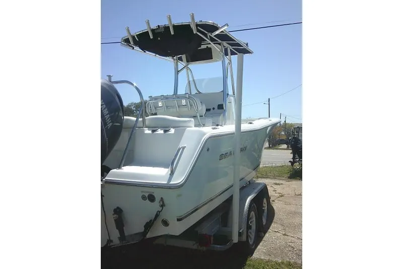Slide: The Image of 2015 Sea Hunt Ultra 225 boat on trailer, rear view, sunny day. - 9