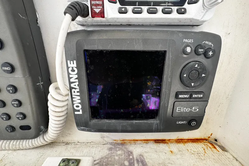 Slide: The Image of Lowrance Elite-5 fishfinder on 2008 Sea Fox 287 CC boat dashboard. - 12