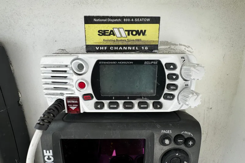 Slide: The Image of VHF radio on 2008 Sea Fox 287 CC boat with Sea Tow contact information. - 14