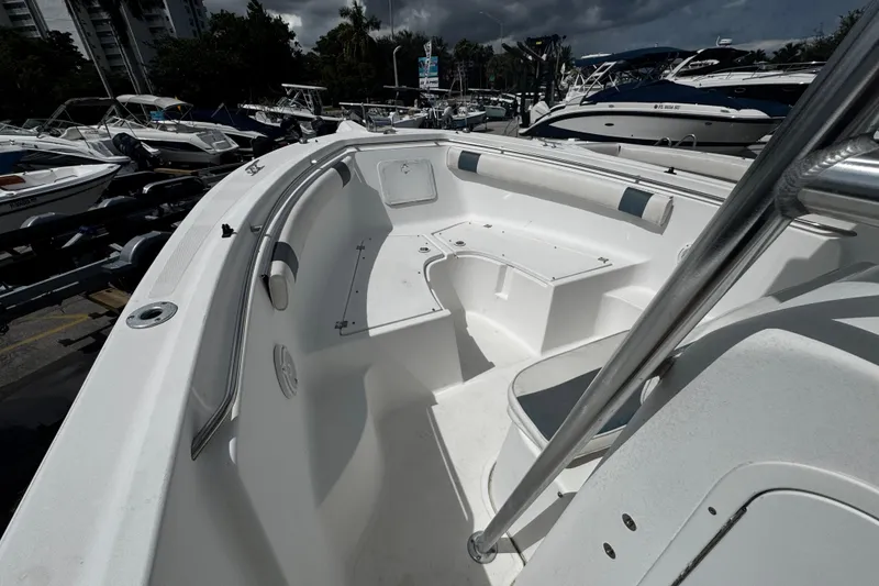 Slide: The Image of 2008 Sea Fox 287 CC boat interior with seating, docked among other boats. - 19
