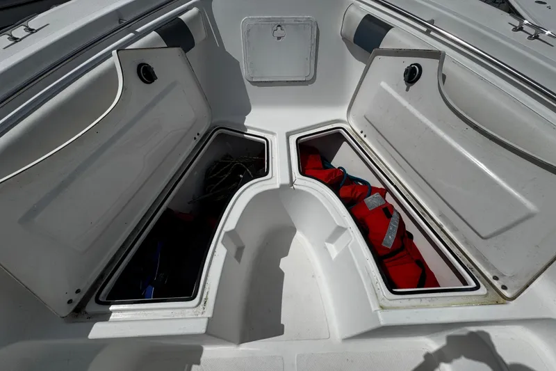 Slide: The Image of Open storage compartments on a 2008 Sea Fox 287 CC boat deck. - 20