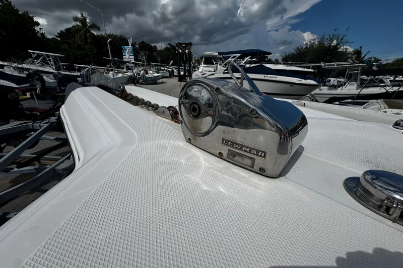 Slide: The Image of 2008 Sea Fox 287 CC boat with Lewmar anchor windlass, docked under cloudy sky. - 21