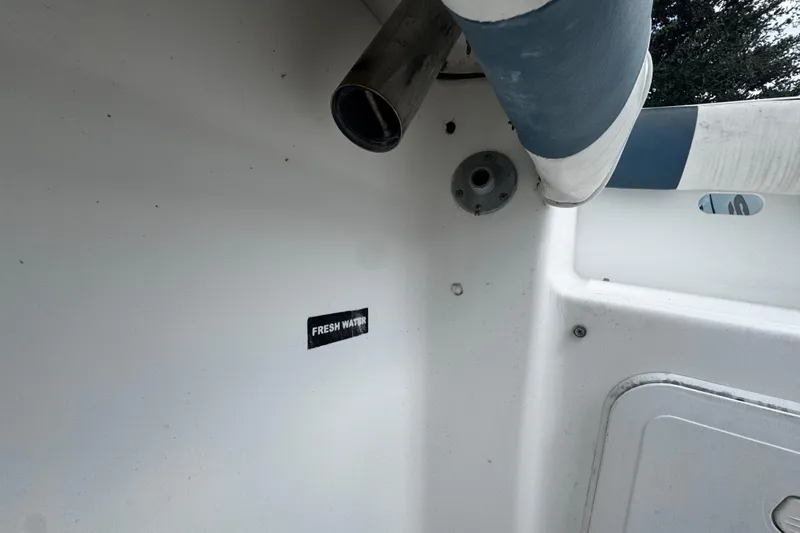 Slide: The Image of 2008 Sea Fox 287 CC boat interior with fresh water label and fittings. - 5