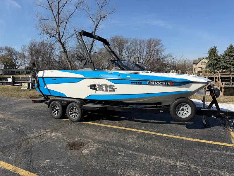 The Image of 2020 Axis A20 boat parked on trailer outdoors. - 0
