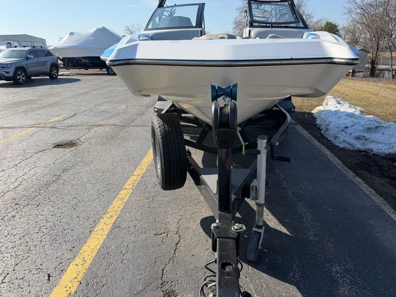 Slide: The Image of 2020 Axis A20 boat parked on trailer outdoors. - 3