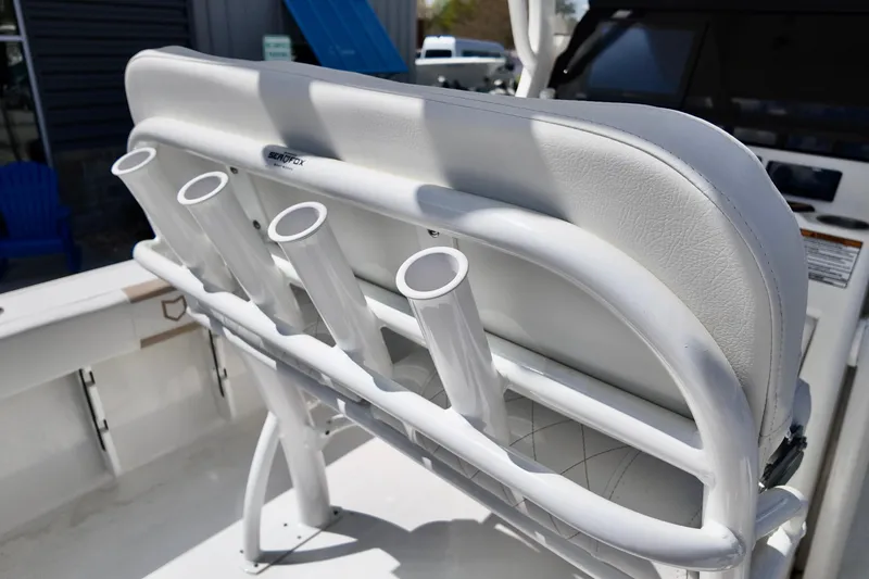 Slide: The Image of 2026 Sea Fox 228 Commander boat with rod holders and cushioned seating. - 10