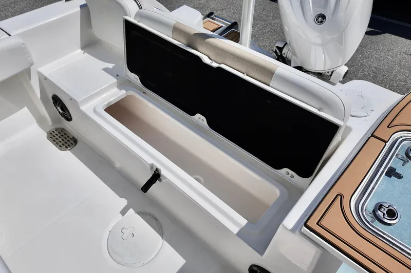 Slide: The Image of Interior view of a 2026 Sea Fox 228 Commander boat, showcasing storage compartment and seating. - 21