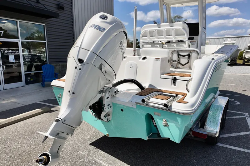 Slide: The Image of 2026 Sea Fox 228 Commander boat with powerful outboard motor, parked outdoors. - 3