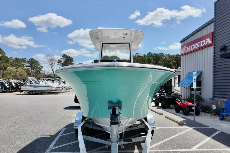 Slide: The Image of 2026 Sea Fox 228 Commander boat displayed at a dealership with Honda signage. - 5