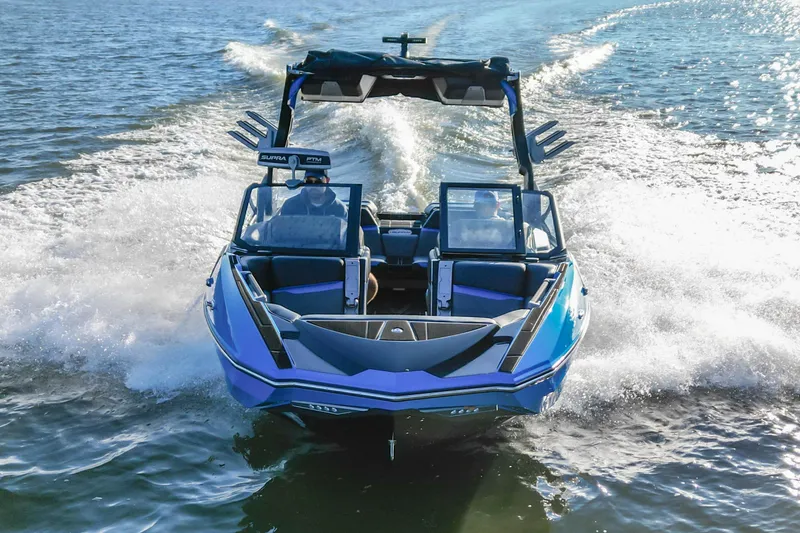Slide: The Image of 2024 Supra SV 400 boat cruising on open water, showcasing sleek design and powerful performance. - 5